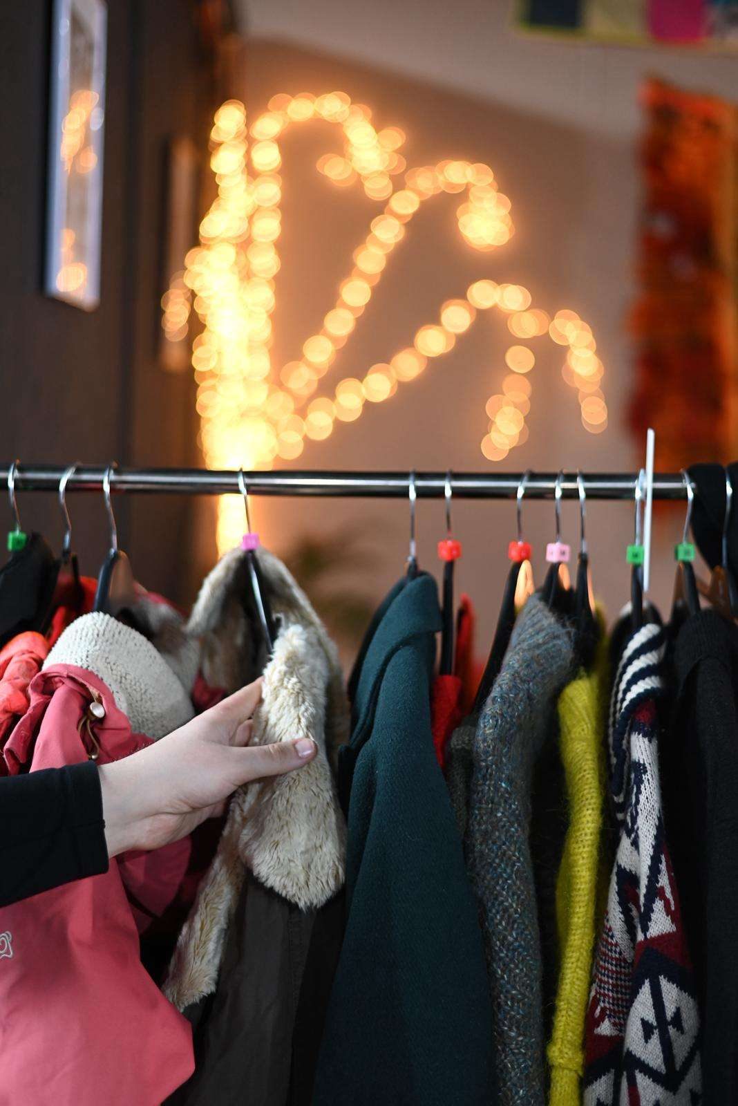 Donated clothing on a warm rail